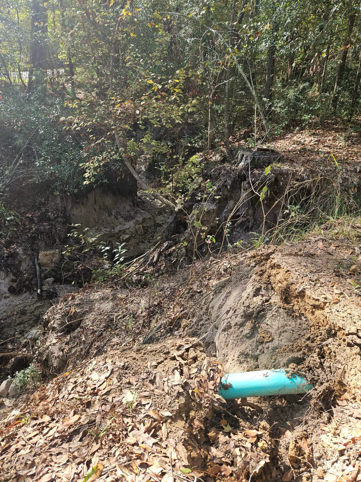 Before — creek undercutting the slope